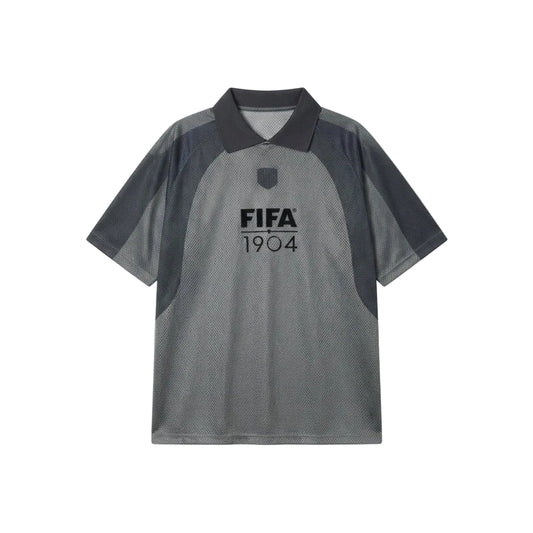 A short-sleeve polo shirt in heather gray and dark charcoal gray, featuring a 'FIFA 1904' logo printed on the chest, displayed flat against a light gray background.